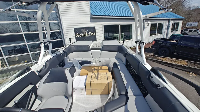 Slide: The Image of Interior of a 2026 Moomba Max boat with boxes. - 11