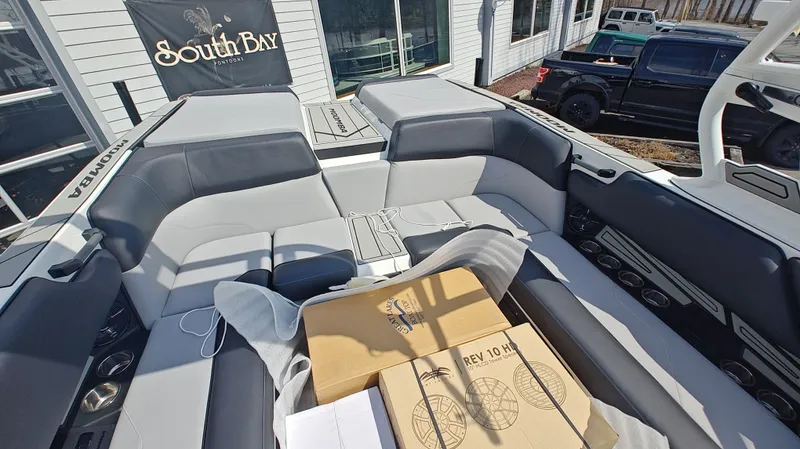 Slide: The Image of Interior of a 2026 Moomba Max boat with boxes. - 13