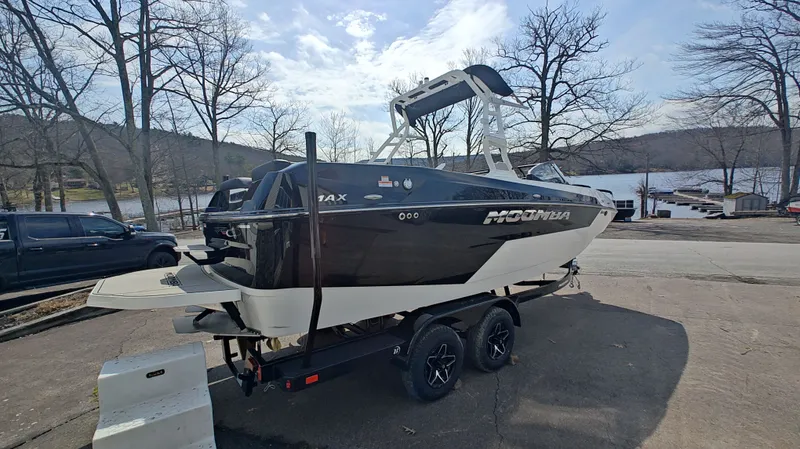 Slide: The Image of 2026 Moomba Max boat on trailer by lakeside. - 15
