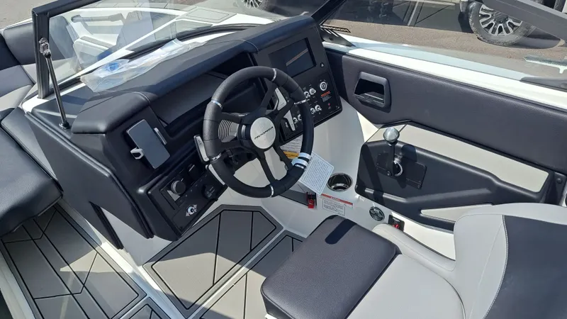Slide: The Image of Interior of 2026 Moomba Max boat with steering wheel and control console. - 7