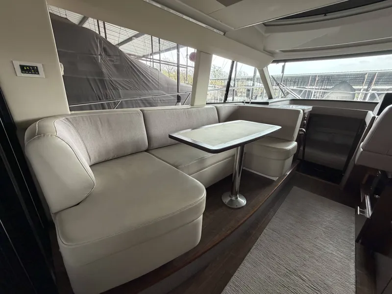 Slide: The Image of Interior of 2017 Regal 42 Grande Coupe with elegant seating area. - 20