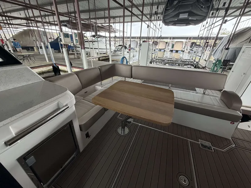 Slide: The Image of Interior of 2017 Regal 42 Grande Coupe with seating area and table. - 21