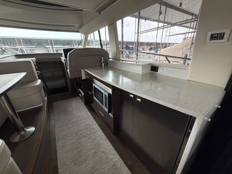 Slide: The Image of Interior of 2017 Regal 42 Grande Coupe with modern kitchen. - 23