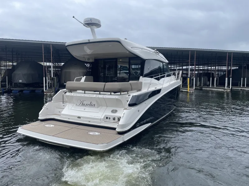 Slide: The Image of 2017 Regal 42 Grande Coupe yacht docked in marina. - 3