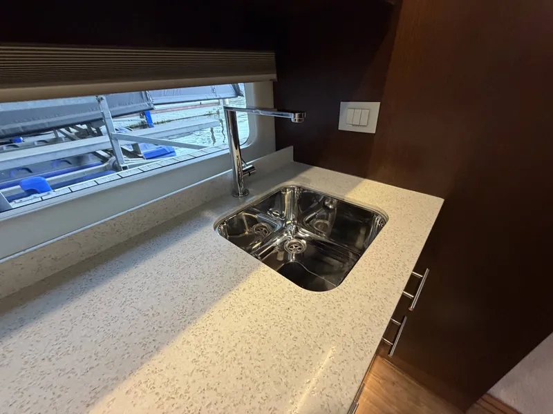 Slide: The Image of Kitchen area of 2017 Regal 42 Grande Coupe with sink. - 37