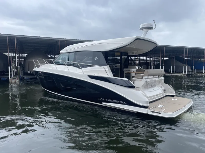 Slide: The Image of 2017 Regal 42 Grande Coupe Yacht docked at marina. - 4