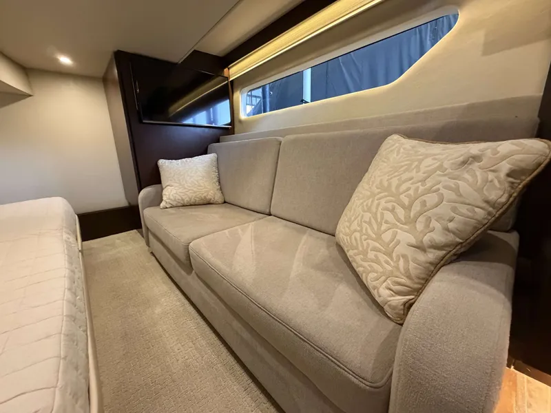 Slide: The Image of Interior of 2017 Regal 42 Grande Coupe with sofa and cushions. - 42