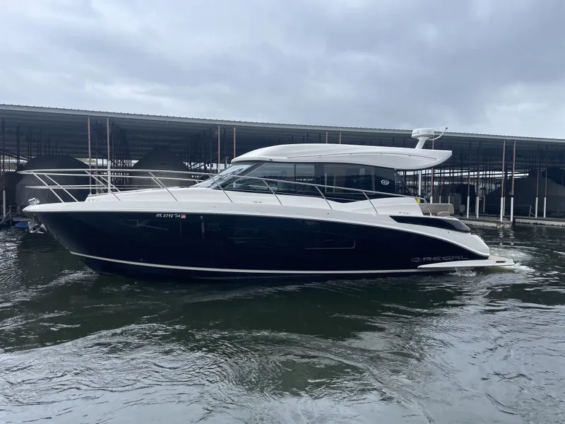 Slide: The Image of 2017 Regal 42 Grande Coupe yacht docked at marina. - 6
