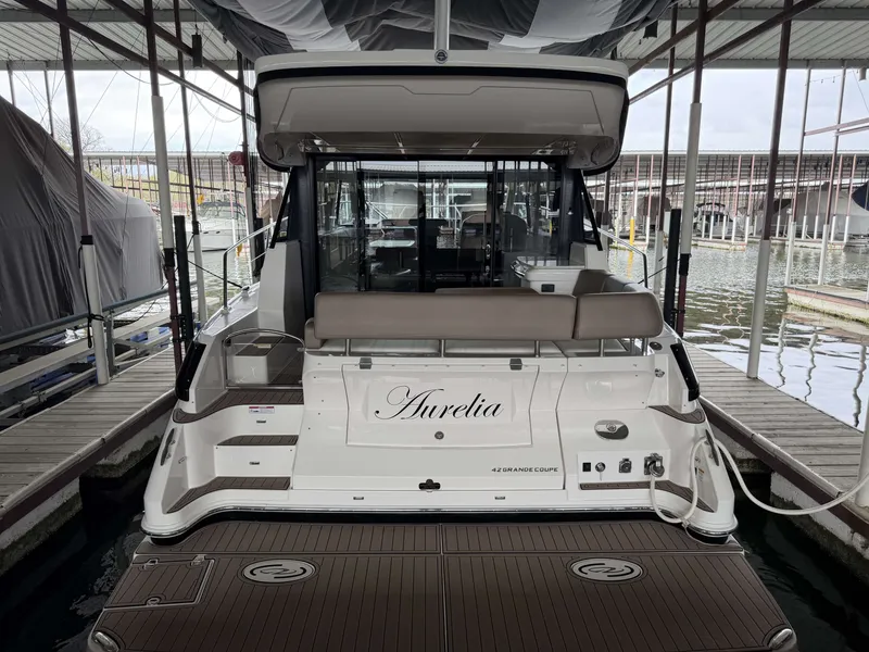 Slide: The Image of 2017 Regal 42 Grande Coupe yacht docked in marina. - 7