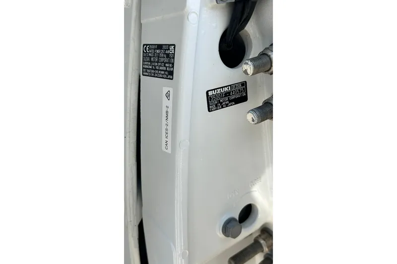 Slide: The Image of Close-up of a 2001 Pro-Line 3400 Bimini Cuddy engine label with Suzuki details. - 22
