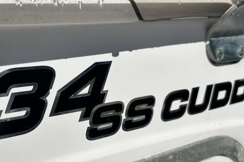 Slide: The Image of Close-up of 2001 Pro-Line 3400 Bimini Cuddy boat lettering on hull. - 24