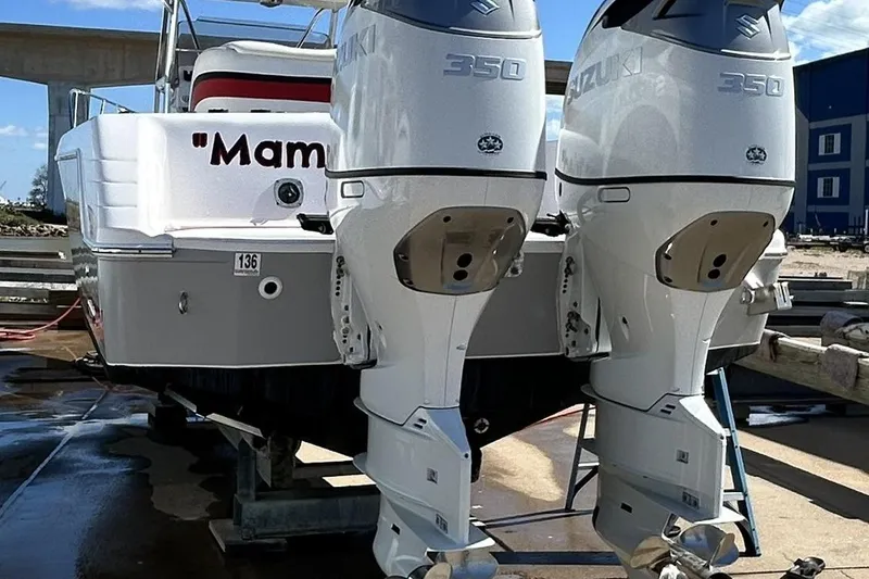 Slide: The Image of 2001 Pro-Line 3400 Bimini Cuddy with twin Suzuki 350 engines on a trailer. - 7