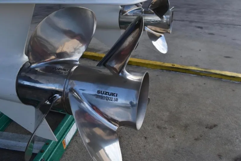 Slide: The Image of Close-up of Suzuki propellers on a 2001 Pro-Line 3400 Bimini Cuddy boat. - 9
