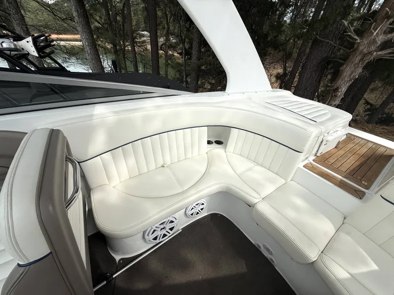 Slide: The Image of Interior of a 2006 Cobalt 263 boat with white leather seating. - 12