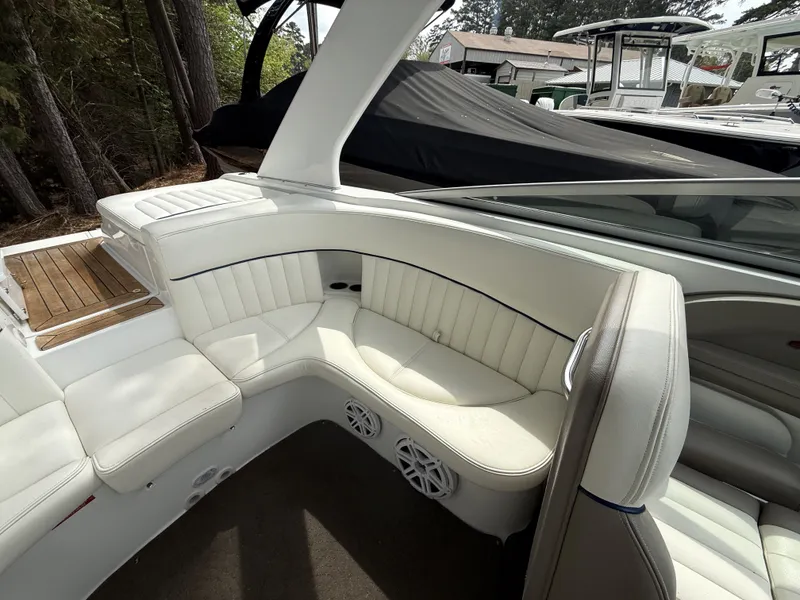 Slide: The Image of Interior of a 2006 Cobalt 263 boat with white leather seating. - 14