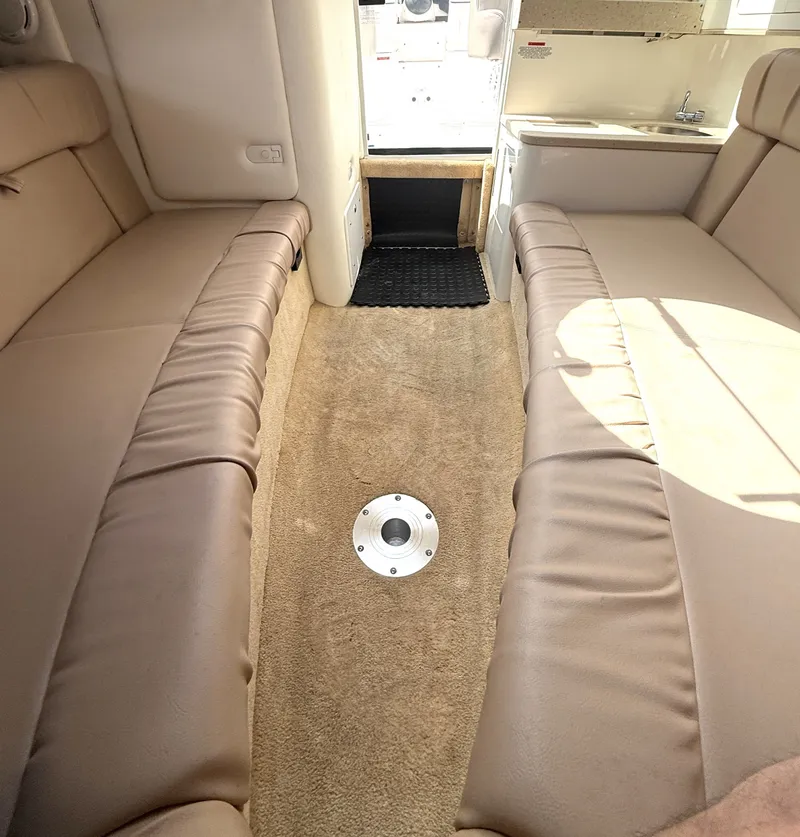 Slide: The Image of Interior of a 2006 Cobalt 263 boat with beige seating. - 16