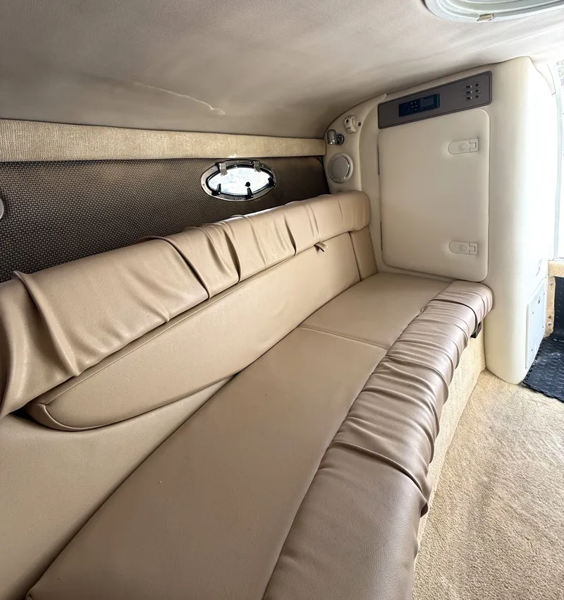 Slide: The Image of Interior of a 2006 Cobalt 263 boat with beige leather sofa. - 17