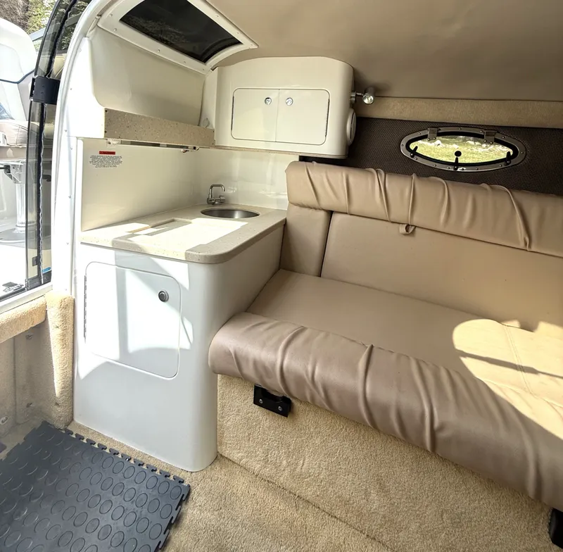 Slide: The Image of Interior of a 2006 Cobalt 263 boat with seating and sink area. - 18