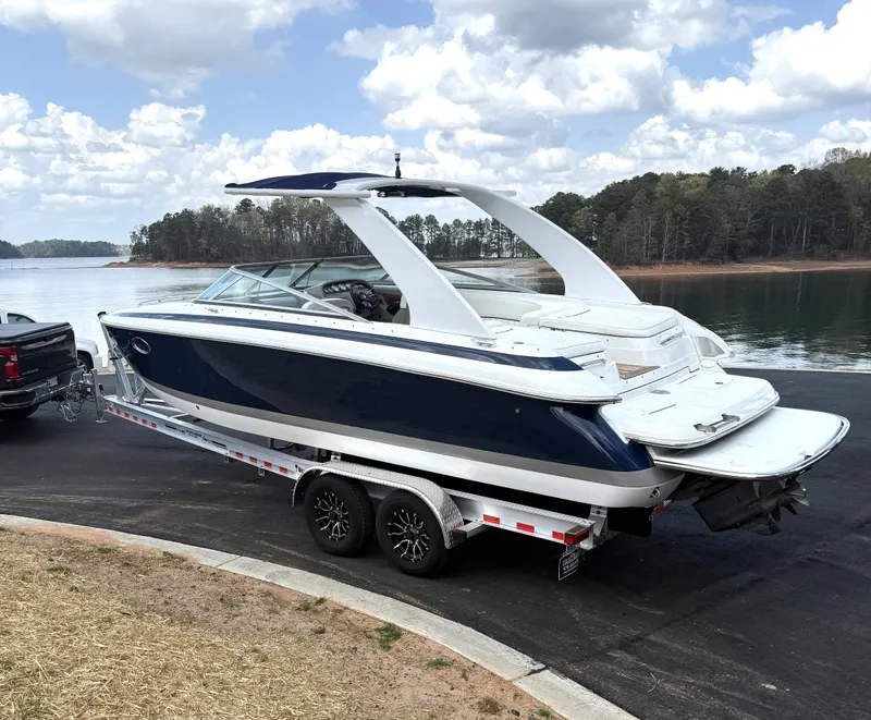 Slide: The Image of 2006 Cobalt 263 boat on trailer by lakeside. - 5