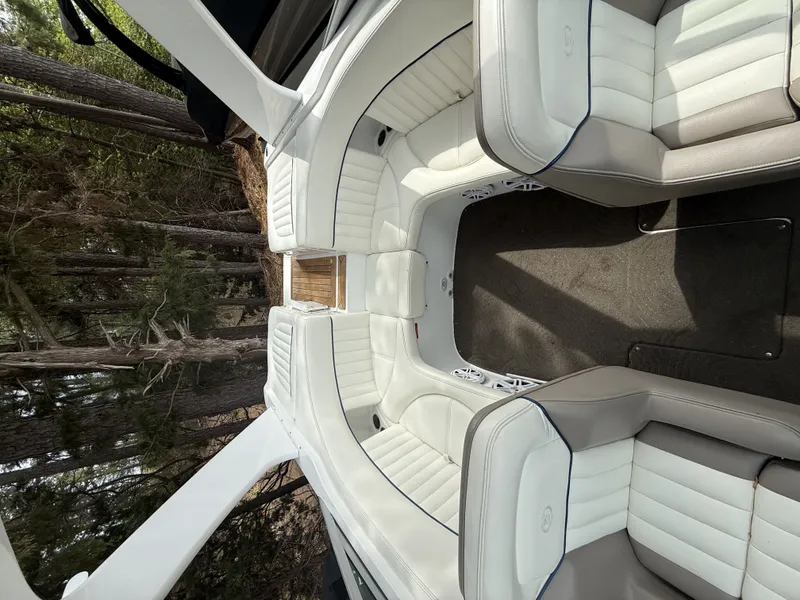 Slide: The Image of Interior of a 2006 Cobalt 263 boat with white leather seats. - 7