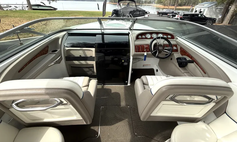 Slide: The Image of Interior of a 2006 Cobalt 263 boat with sleek seating and dashboard. - 8