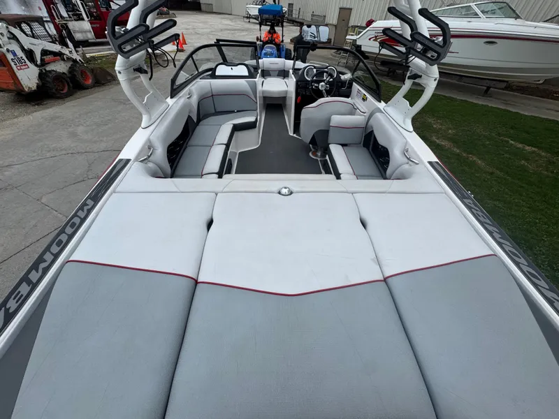 Slide: The Image of Interior view of a 2017 Moomba Mondo boat with gray and white seating. - 11