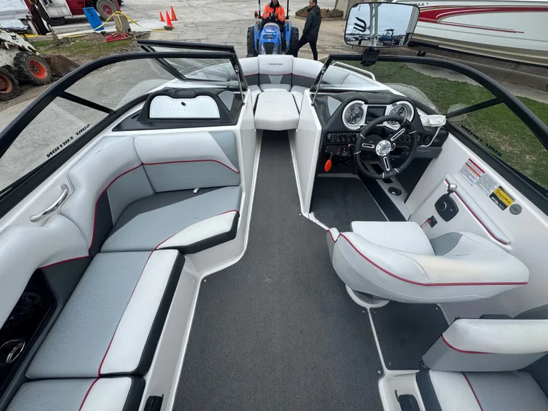 Slide: The Image of Interior of a 2017 Moomba Mondo boat with gray and red seating. - 14