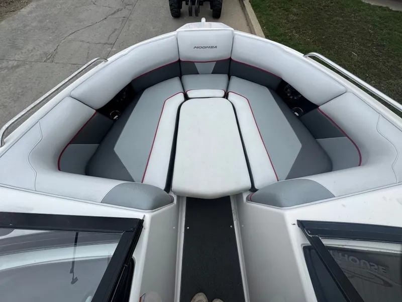 Slide: The Image of Interior of a 2017 Moomba Mondo boat with gray and red seating. - 16