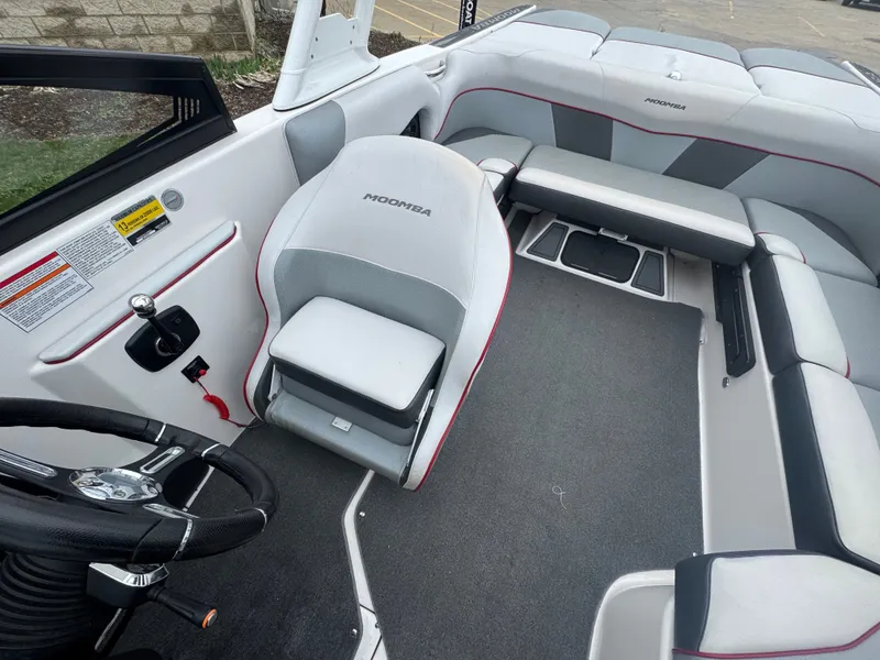 Slide: The Image of Interior of a 2017 Moomba Mondo boat with gray seating. - 18