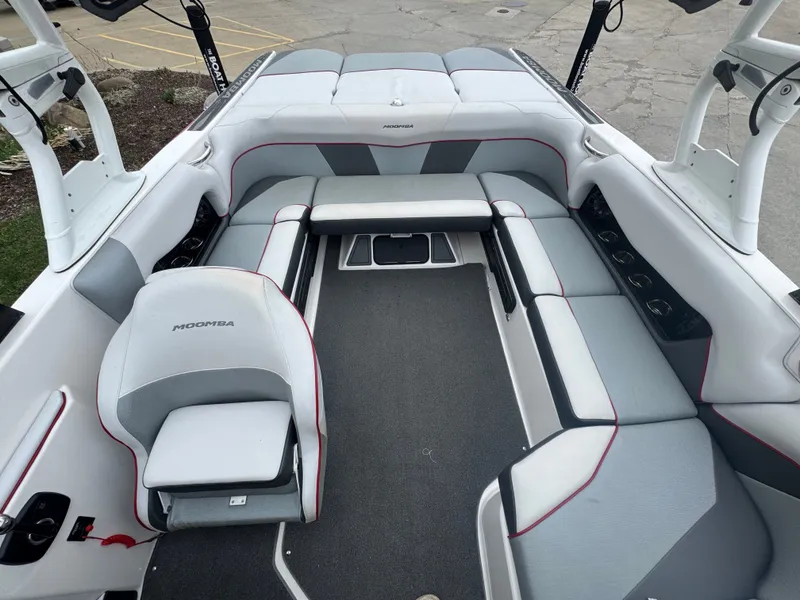 Slide: The Image of Interior of a 2017 Moomba Mondo boat with gray seating. - 19