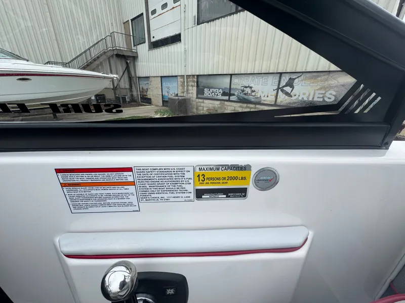 Slide: The Image of 2017 Moomba Mondo boat with capacity label, maximum 13 persons. - 22