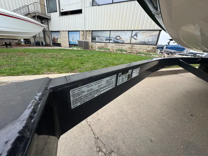 Slide: The Image of 2017 Moomba Mondo boat trailer with manufacturer label outdoors. - 6