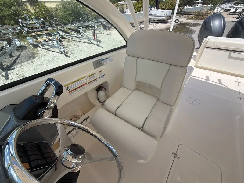 Slide: The Image of Interior view of a 2014 Pursuit DC 265 Dual Console boat. - 11
