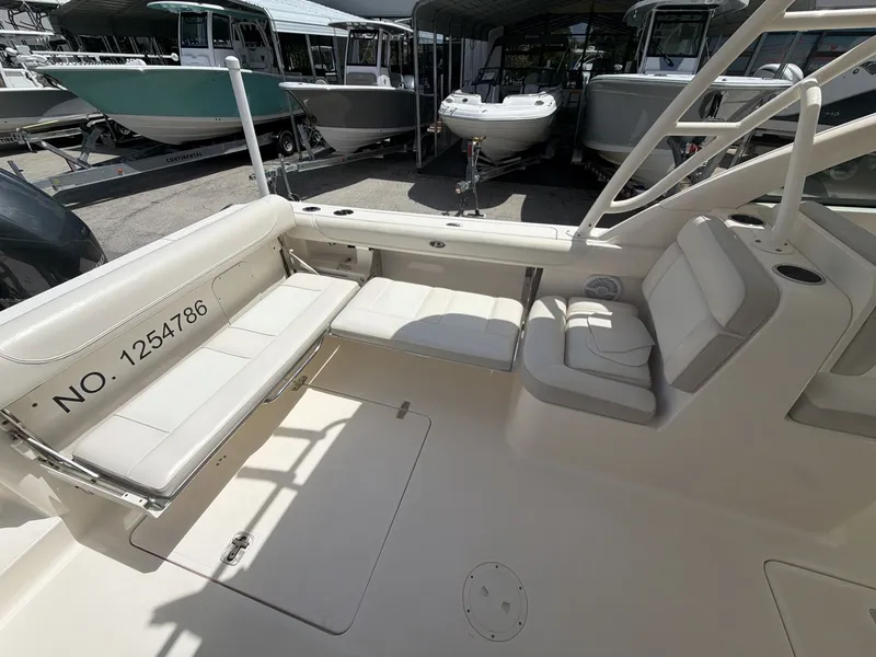 Slide: The Image of Interior of a 2014 Pursuit DC 265 Dual Console boat. - 14