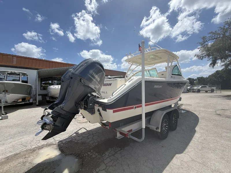 Slide: The Image of 2014 Pursuit DC 265 Dual Console boat with Yamaha outboard motor. - 16