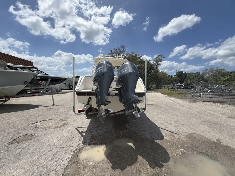 Slide: The Image of 2014 Pursuit DC 265 Dual Console with twin outboard engines. - 6