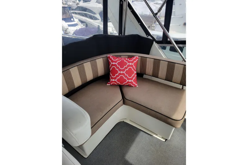 Slide: The Image of Interior of 1998 Tollycraft 65 Pilothouse yacht with red cushion. - 29