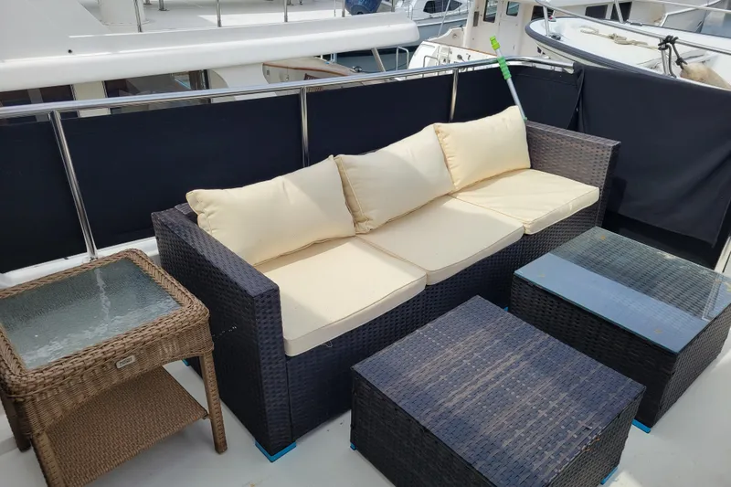 Slide: The Image of 1998 Tollycraft 65 Pilothouse yacht with stylish outdoor seating area. - 32