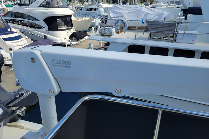 Slide: The Image of 1998 Tollycraft 65 Pilothouse yacht with Steelhead Marine ES1000 crane at marina. - 35