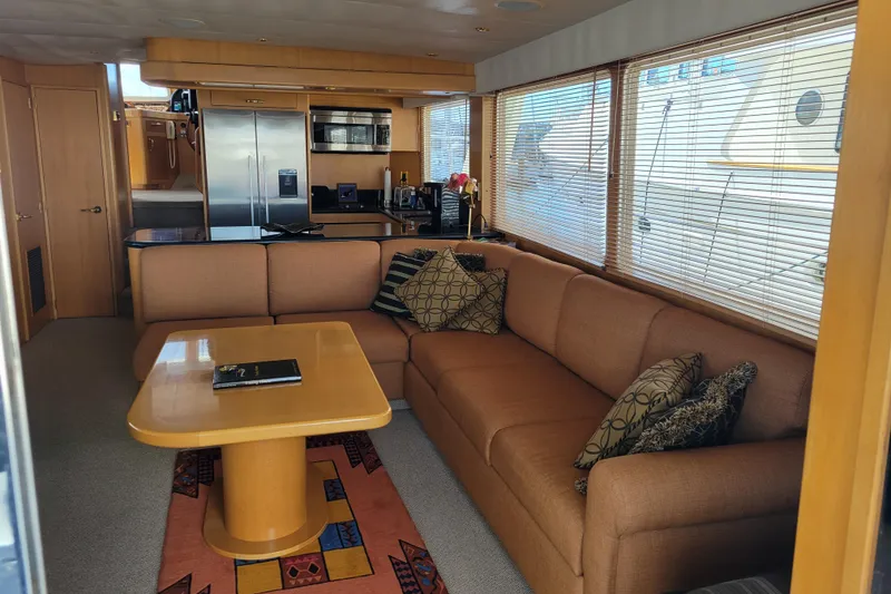 Slide: The Image of Luxurious interior of a 1998 Tollycraft 65 Pilothouse yacht with cozy seating and modern kitchen. - 38