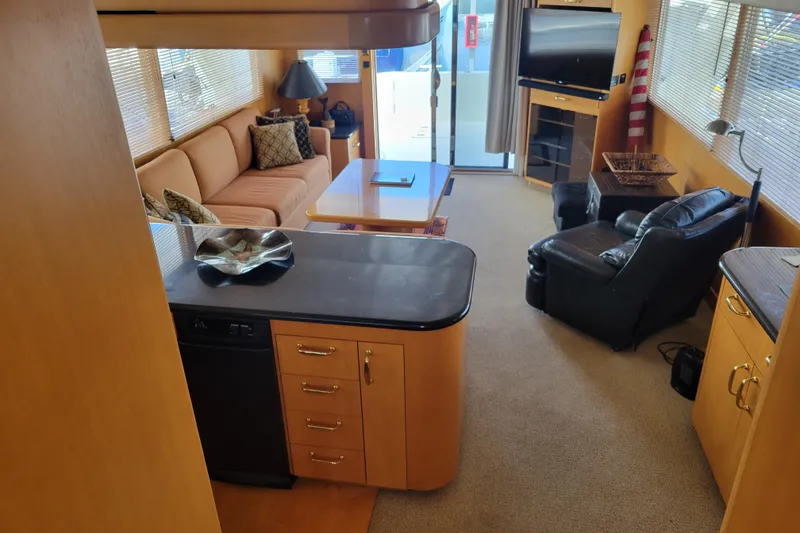 Slide: The Image of Luxurious interior of a 1998 Tollycraft 65 Pilothouse yacht with modern furnishings. - 39