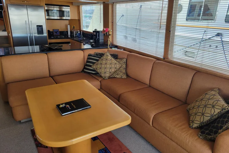 Slide: The Image of Luxurious interior of a 1998 Tollycraft 65 Pilothouse yacht with cozy seating and modern kitchen. - 42