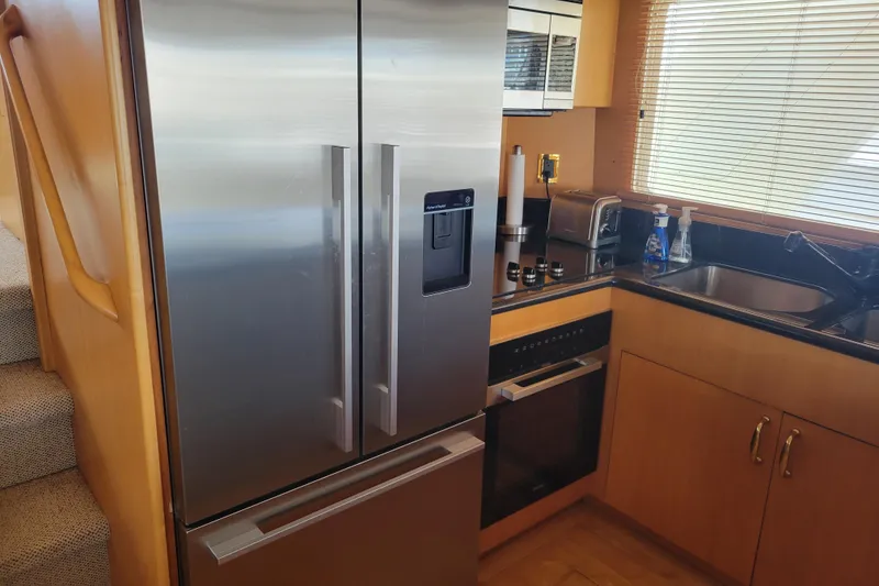 Slide: The Image of Modern kitchen in 1998 Tollycraft 65 Pilothouse yacht with stainless steel appliances. - 44