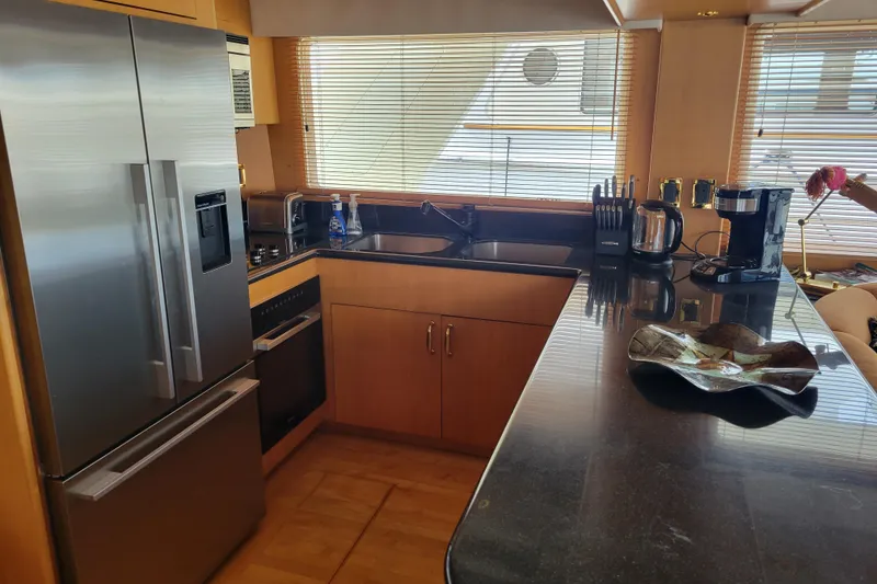 Slide: The Image of Luxurious kitchen interior of 1998 Tollycraft 65 Pilothouse yacht with modern appliances. - 45