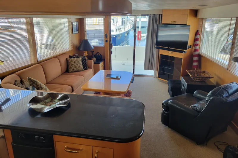 Slide: The Image of Luxurious interior of a 1998 Tollycraft 65 Pilothouse yacht with modern furnishings. - 47
