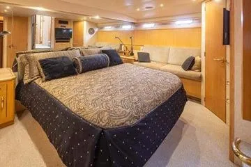 Slide: The Image of Luxurious bedroom interior of 1998 Tollycraft 65 Pilothouse yacht with elegant bedding. - 48