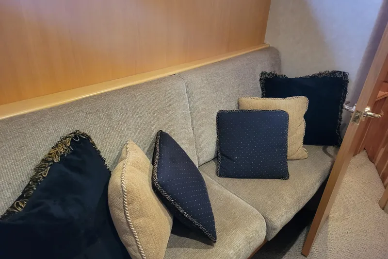 Slide: The Image of Cozy seating area with decorative cushions on a 1998 Tollycraft 65 Pilothouse yacht. - 51