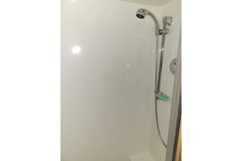 Slide: The Image of Shower area in 1998 Tollycraft 65 Pilothouse yacht, featuring chrome fixtures. - 59