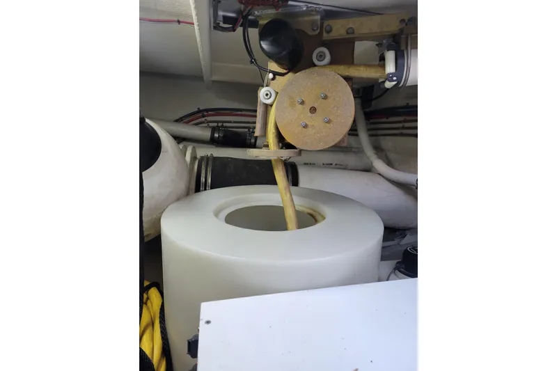 Slide: The Image of Engine room of 1998 Tollycraft 65 Pilothouse with mechanical components and wiring. - 74