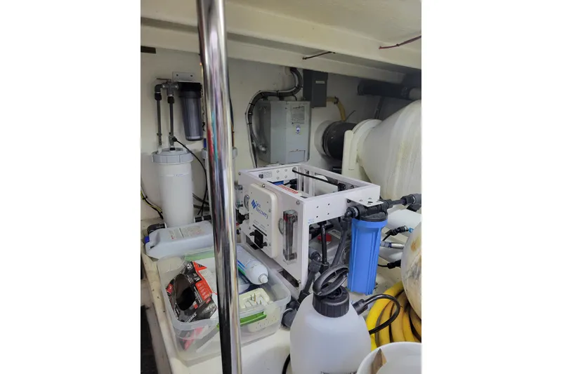 Slide: The Image of Engine room of 1998 Tollycraft 65 Pilothouse with water filtration system and equipment. - 75